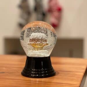 Snow globe is on the table