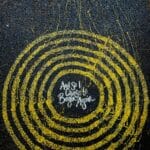 yellow and black round logo